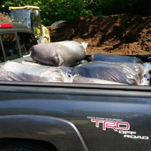 Delivery guy today. 15 bags of mulch for my in laws.