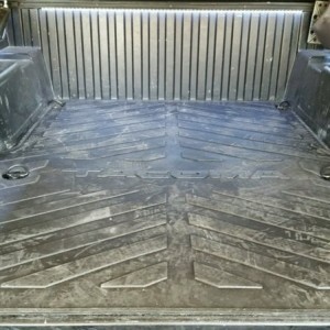 New bed mat with extra tie down cut outs.