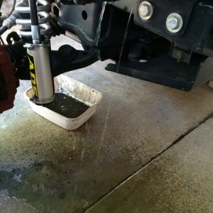 Well...I guess that wasn't just a tab that held the washer reservoir in...