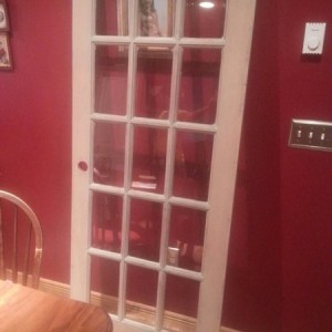 Wife wanted a distressed finish on this door to put pictures in the panes and hang the door horizontally on the wall. The debate is...whiter or keep i