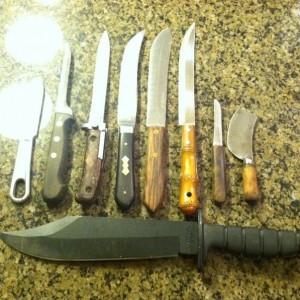 My crappy knife collection. Nothing more than $1. Well, except for the Ontario. :D