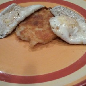 Couple of over medium eggs and homemade cheesy potato cake/hash brown kinda things. Cholesterol is gonna be sky high soon i fear