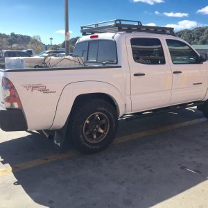 1400 pounds of tile in the back. Squatting all the way to the bumps. Wish I caught a pic of my buddy's 4 banger 5 lug.