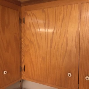 Is it possible to stain these cabinets dark stained without having to sand everything down? I may replace the doors, but want to go dark on everything