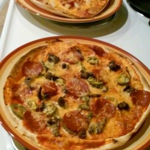 Left over smoked bbq shoulder, jalaes, and pepperoni and pepperoni an pineapple tortilla pizzas