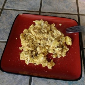 Scrambled eggs with red pepper, white pepper and black pepper.