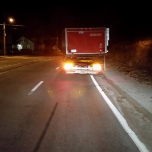 Trailer getting towed on flat bed