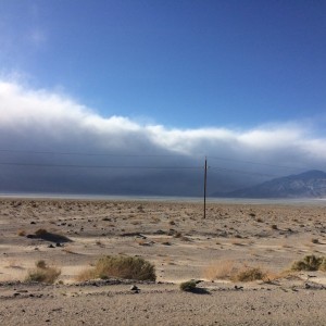 Death Valley - Clouds merging with mountain