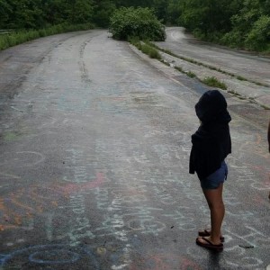 Daughter trying to read the graffiti.