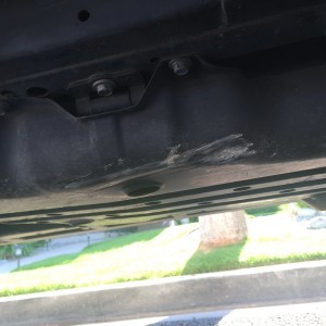Dented gas tank skid